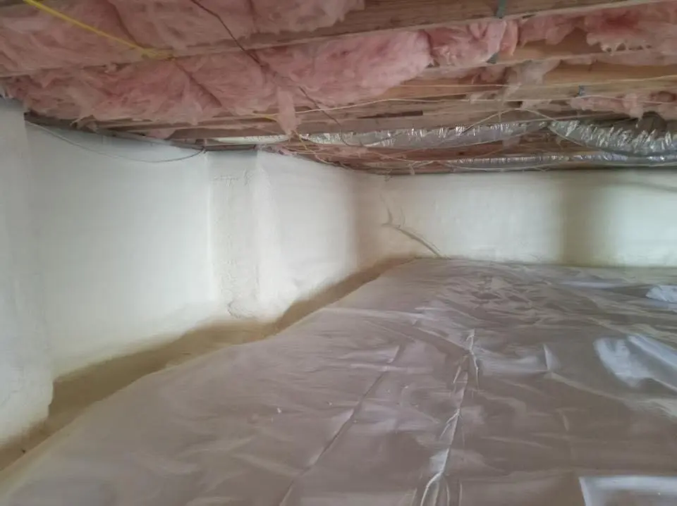Crawl space encapsulation with closed-cell spray foam for Storm Damage Roof Repair in Madison